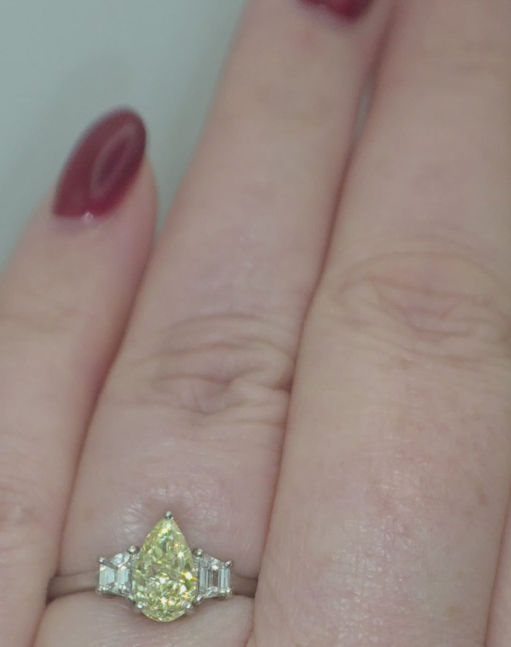 Platinum, 1.24ct VVS1, Pear Cut Yellow Diamond & 0.28 VVS2-VS1 Trapezoid White Diamond Ring. Size S. Includes a GIA Report.