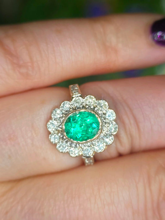 A stunning 1.3ct F1 Columbian emerald & 0.5ct Diamond Flower Ring. Size N. Includes WGI Appraisal & Valuation.